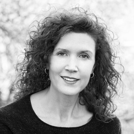 Black and white photo of a woman with curly hair